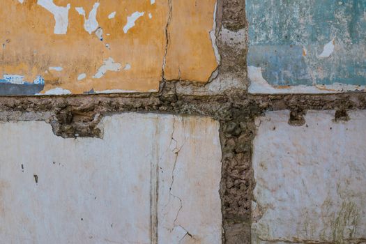 Lines of the former walls and blocks of the walls still painted with the original color, remaining after partly demolition of a house.