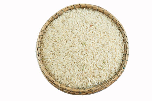 brown rice on bamboo basket isolate on white