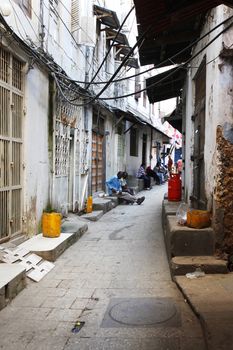 Stone Town, Zanzibar, Tanzania - January 1, 2016: People going about their daily business in Stone Town market, on the island of Zanzibar