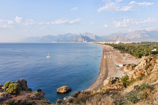 Konyaalti Beach at Antalya in Turkey with Bydaglari Mountains in the background.