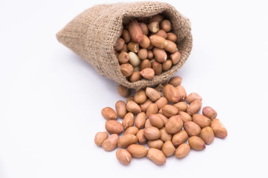 Peanut in Gunny Bag on white background