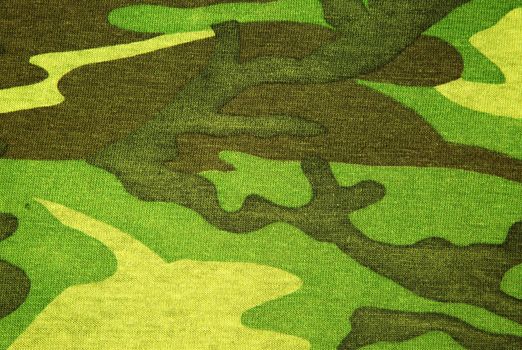 Interesting texture and background green camouflage , textile ,military material.Interesting texture. Horizontal view.