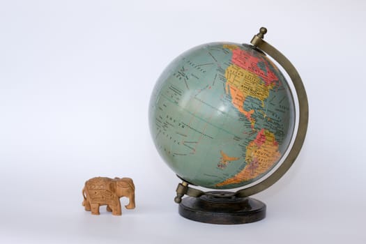 Globe with an wooden elephant
