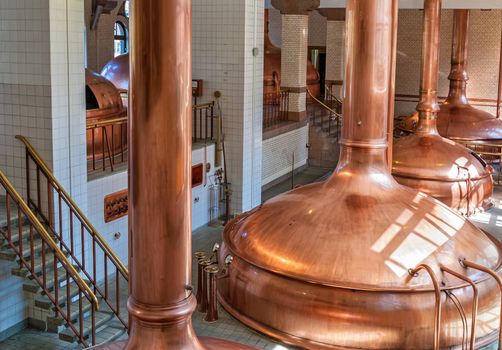 Iinterior of brewery workshop with copper fermentation vats