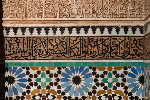 Details of the mosaic with floral pattern and arabic script parts.