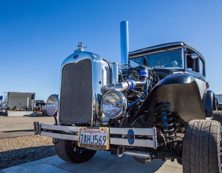 Redding, California, USA- February 13, 2016: A Ford hot rod's engine is on display for the crowd at the Redding Drags in northern California.