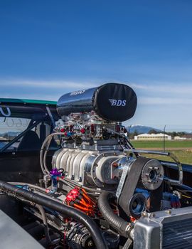Redding, California, USA- February 13, 2016: A hot rod's engine is on display for the crowd at the Redding Drags in northern California.