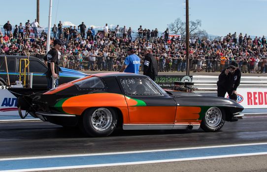 Redding, California: A modified Chevy Corvette moves up the starting line at a drag race.
Photo taken on: February 13th, 2016