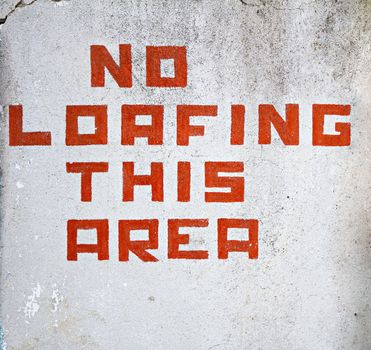 sign displaying to others that they shouldn't be loafing around 