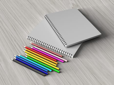 color pencil on checked notebook on wood background, stationary object