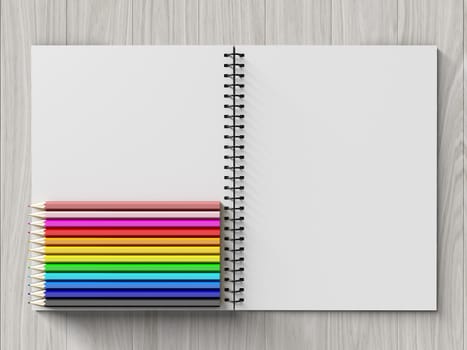 color pencil on checked notebook on wood background, stationary object