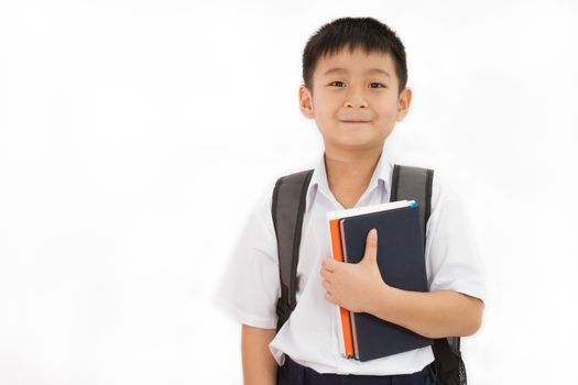 Asian Little School Boy Holding Books with Backpack on White Background