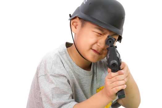 Asian Little Boy Playing Plastic Toy AK47 with Police Helmet on White Background