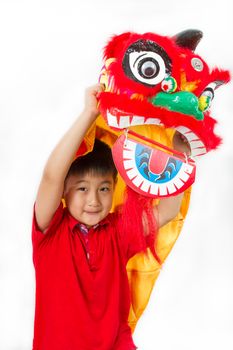 Asian Little Boy in Chinese Lion Custome Dance During Chinese New Year Celebration on White Background