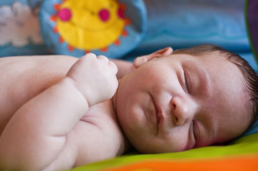 Closeup portrait of the little smiling baby