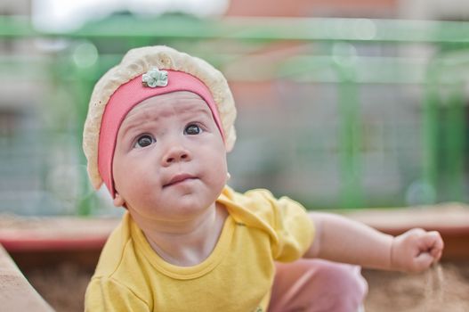 the Little smiling baby in hat horizontal  portrait