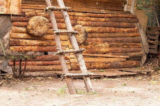 a shooting gallery and a staircase in a wooden house frame