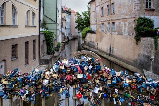 Romantic place on a small bridge in the old city of Prague, used by many couples to lock their love.