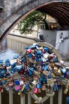 Romantic place on a small bridge in the old city of Prague, used by many couples to lock their love.