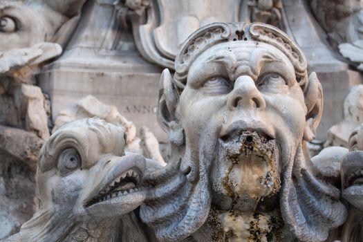 One of the roman beautiful fountains. This one is located in front of famous Pantheon. Baroque faces and fishes.