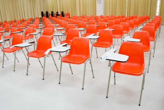 empty classroom and orange chairs