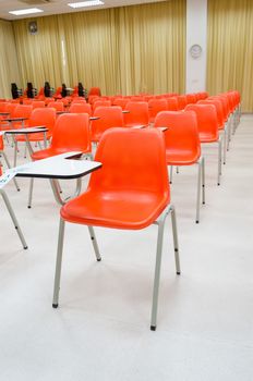 orange chairs  in classroom