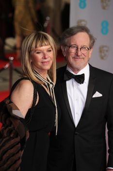 UK, London: American director Steven Spielberg and wife Kate Capshaw pose on the red Carpet at the EE British Academy Film Awards, BAFTA Awards, at the Royal Opera House in London, England, on 14 February 2016. 