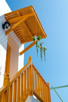 Balcony extends from the second floor of the house.