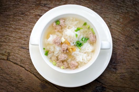 Boiled rice with pork in white  bowl. Thailand is a popular breakfast.