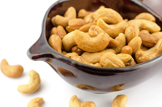 Roasted Cashew nuts are salty on white background