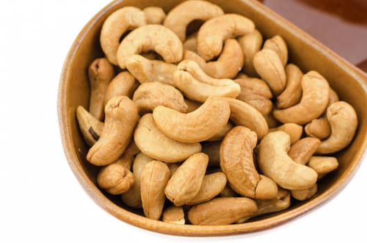 Roasted Cashew nuts are salty on white background