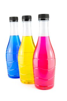 Bright colorful water in bottles on white background