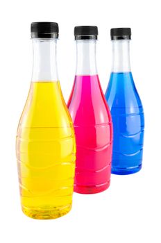 Bright colorful water in bottles on white background