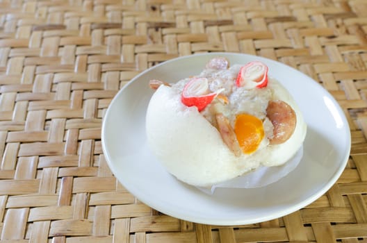 Chinese steamed bun stuffed with  pork,sausage,egg yolk
and crab.