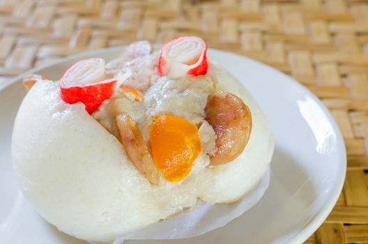 Chinese steamed bun stuffed with  pork,sausage,egg yolk
and crab.