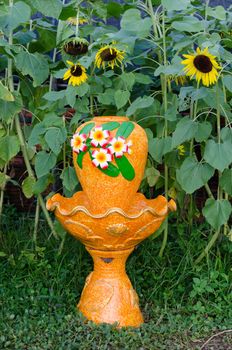 Outdoor orange Fountain in the Garden sunflowers