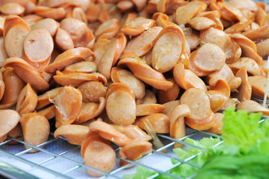 Sausage, cut into small pieces. Fried with oil.