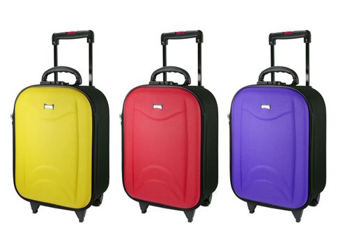 Colorful Travel luggage isolated on the white background.