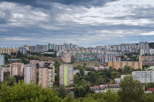 High concentration of the buildings in the modern settlement in Bratislava, Slovakia. Heavy cloudy rainy sky.