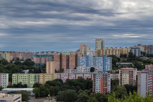 High concentration of the buildings in the modern settlement in Bratislava, Slovakia. Heavy cloudy rainy sky.