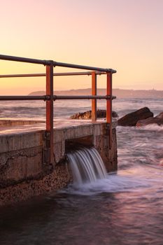 North Curl Curl rock pool overflow just before the sunrise