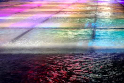 Colorful details of the water in a fountain.