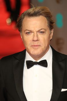 UK, London: British stan-up comedian Eddie Izzard poses on the red Carpet at the EE British Academy Film Awards, BAFTA Awards, at the Royal Opera House in London, England, on 14 February 2016.