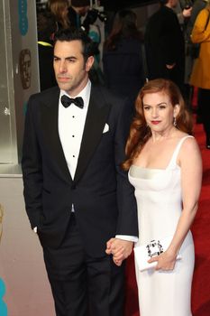 UK, London: Australian actress Isla Fisher poses with husband Sacha Baron Cohen on the red Carpet at the EE British Academy Film Awards, BAFTA Awards, at the Royal Opera House in London, England, on 14 February 2016.