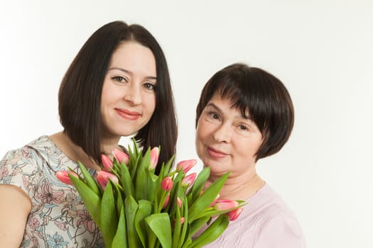 the woman presented a bouquet of flowers for mother