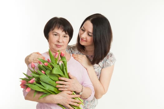 the woman presented a bouquet of flowers for mother