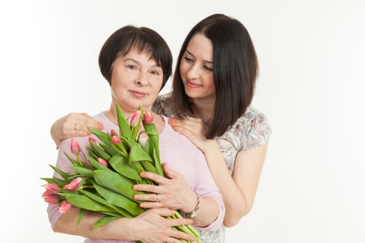 the woman presented a bouquet of flowers for mother