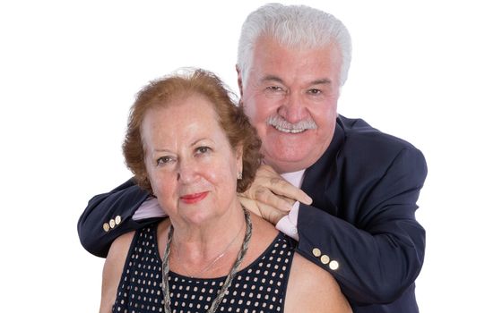 High angle view of cheerful husband in blue suit leaning slightly on back of his grinning wife over white background