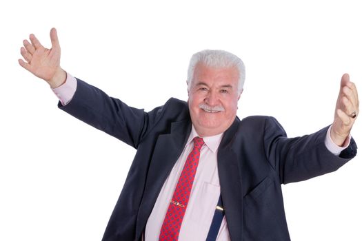 Single elated mature male in blue suit, necktie and suspenders with wide open arms over white background