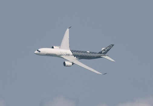 Singapore - February 14, 2016: Airbus A350 XWB during it’s performance at Singapore Airshow at Changi Exhibition Centre in Singapore.